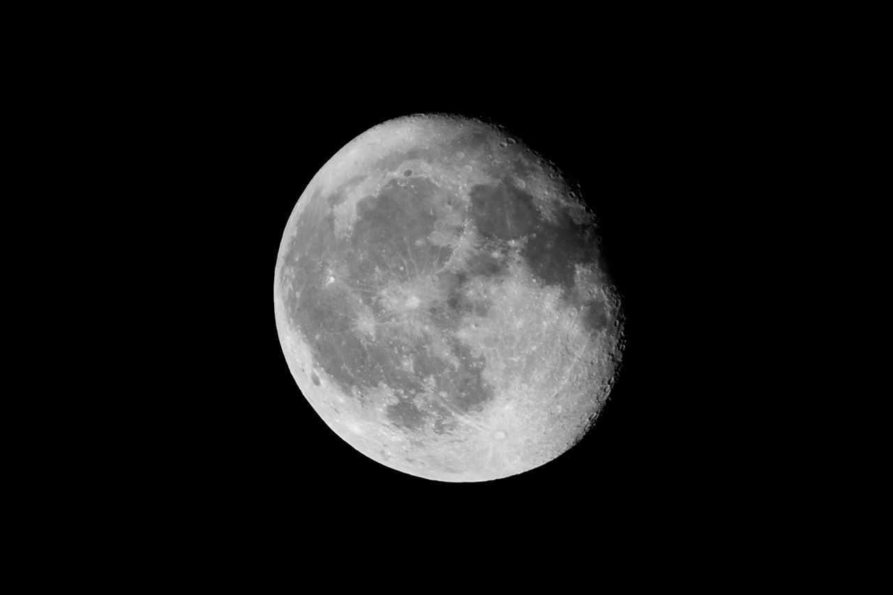 LOW ANGLE VIEW OF MOON AGAINST CLEAR SKY