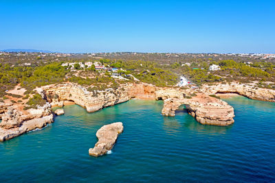 Scenic view of sea against clear blue sky