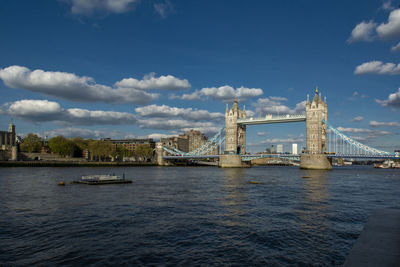 View of bridge over river in city