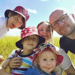 Portrait of happy family in countryside. 