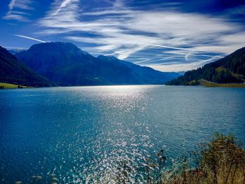 Scenic view of lake and mountains against sky