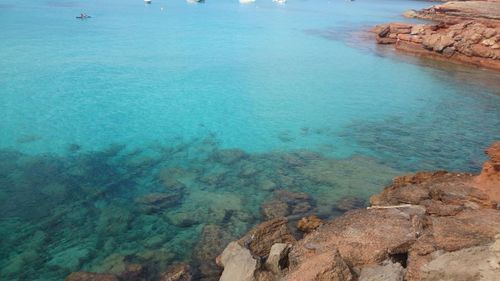 High angle view of rocks in sea