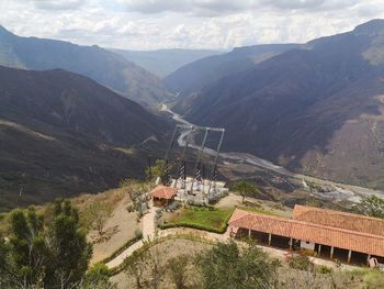High angle view of buildings and mountains against sky