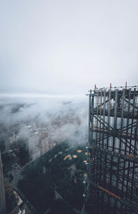 High angle view of buildings by sea against sky