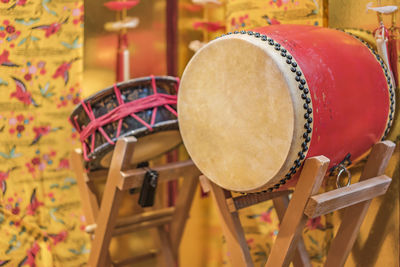 Okinawan traditional music instruments drums taiko on a concert stand.