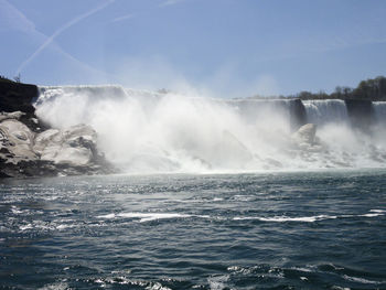 Scenic view of waterfall against clear sky