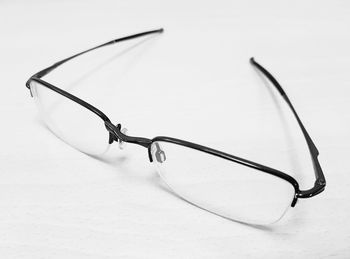 Close-up of eyeglasses against white background