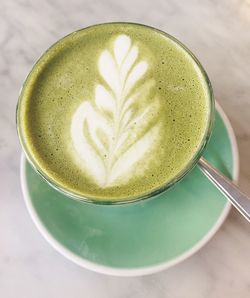 High angle view of cappuccino on table