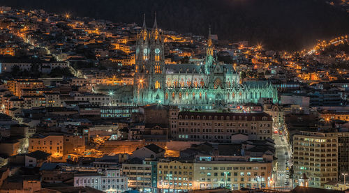 Aerial view of city lit up at night