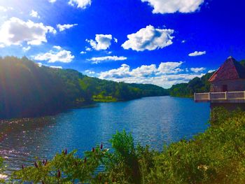 Scenic view of lake against cloudy sky