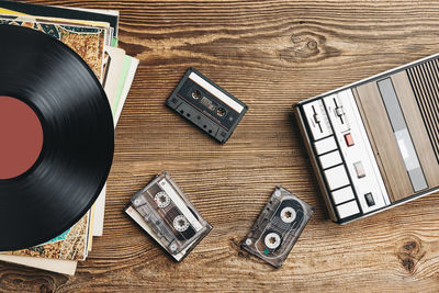 Vinyl records, cassette tapes and recorder. retro music style. 80s music party. back to the past