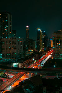 High angle view of illuminated city buildings at night