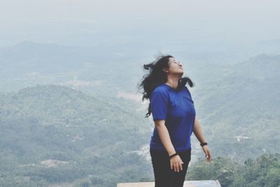 Young woman looking at mountains