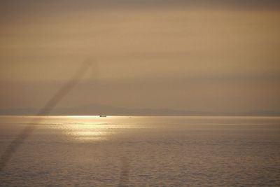 Scenic view of sea at sunset