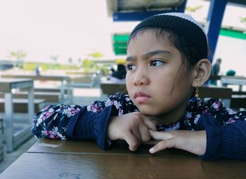 Portrait of a girl sitting and looking at something