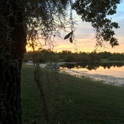 Scenic view of calm lake at sunset