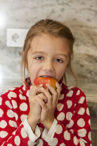 Portrait of cute boy eating food