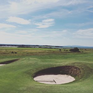 High angle view of golf course against sky