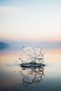Scenic view of sea against sky at sunset