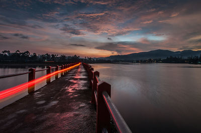 Scenic view of river against sky during sunset