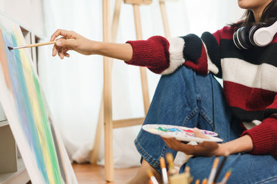 Young woman painting