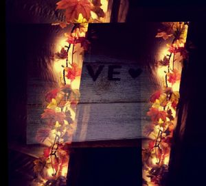 Close-up of lit candles in the dark