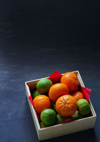 High angle view of fruits in container on table