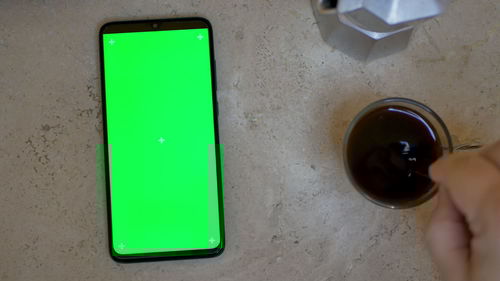 High angle view of person holding drink