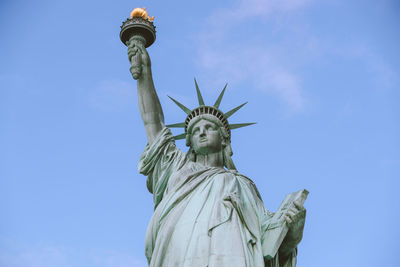 Low angle view of statue against sky