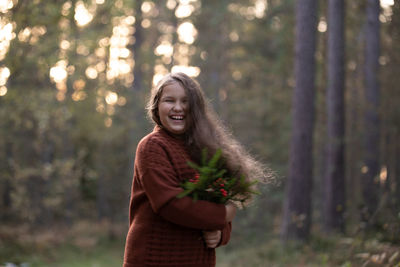 Autumn outdoor portrait of girl walking in forest