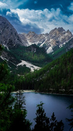 Scenic view of lake and mountains against sky