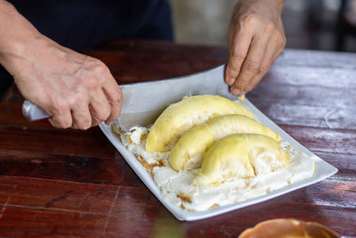 Close-up of person preparing food