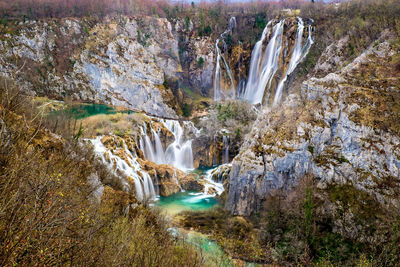 Scenic view of waterfall in forest. plitvice, croatia.