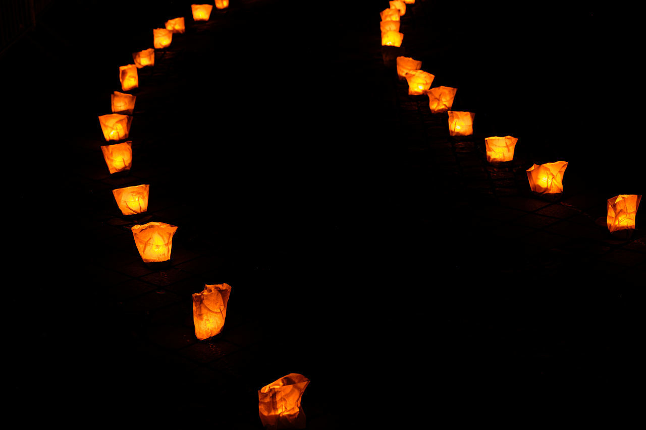 font, lighting equipment, illuminated, lantern, chinese lantern, lighting, no people, night, darkness, chinese lantern festival, orange color, celebration, tradition, in a row, light, jack-o'-lantern, traditional festival, black background, chinese new year