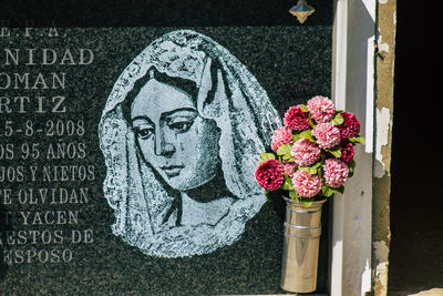 Close-up of flower bouquet on cemetery