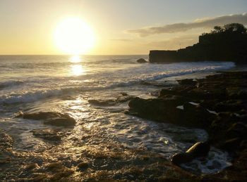 Scenic view of sea at sunset