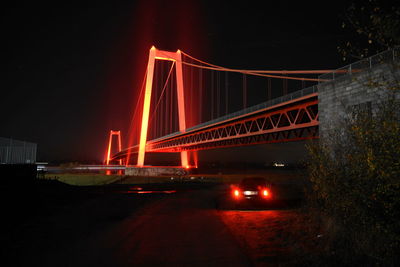 View of suspension bridge at night