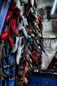 Various shoes for sale at market stall