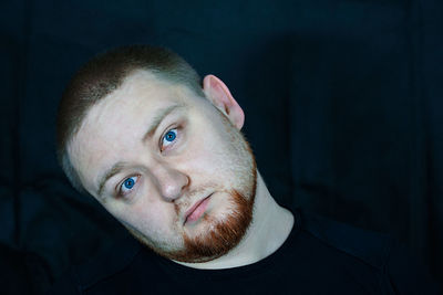 Close-up portrait of man with blue eyes