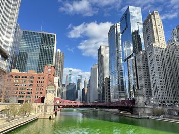 Modern buildings in city against sky