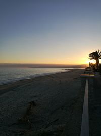 Scenic view of beach against sky during sunset