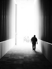 Woman walking in corridor