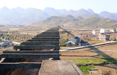 View of landscape with mountain range in background
