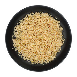 High angle view of pasta in bowl against black background