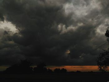 Scenic view of storm clouds over landscape