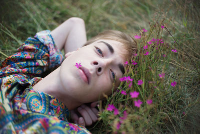 Portrait of man lying on plant