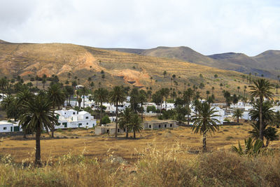 Scenic view of landscape and mountains against sky