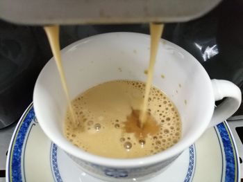 High angle view of coffee cup on table