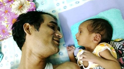 Close-up of father with daughter at home