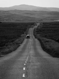 Car on road along landscape